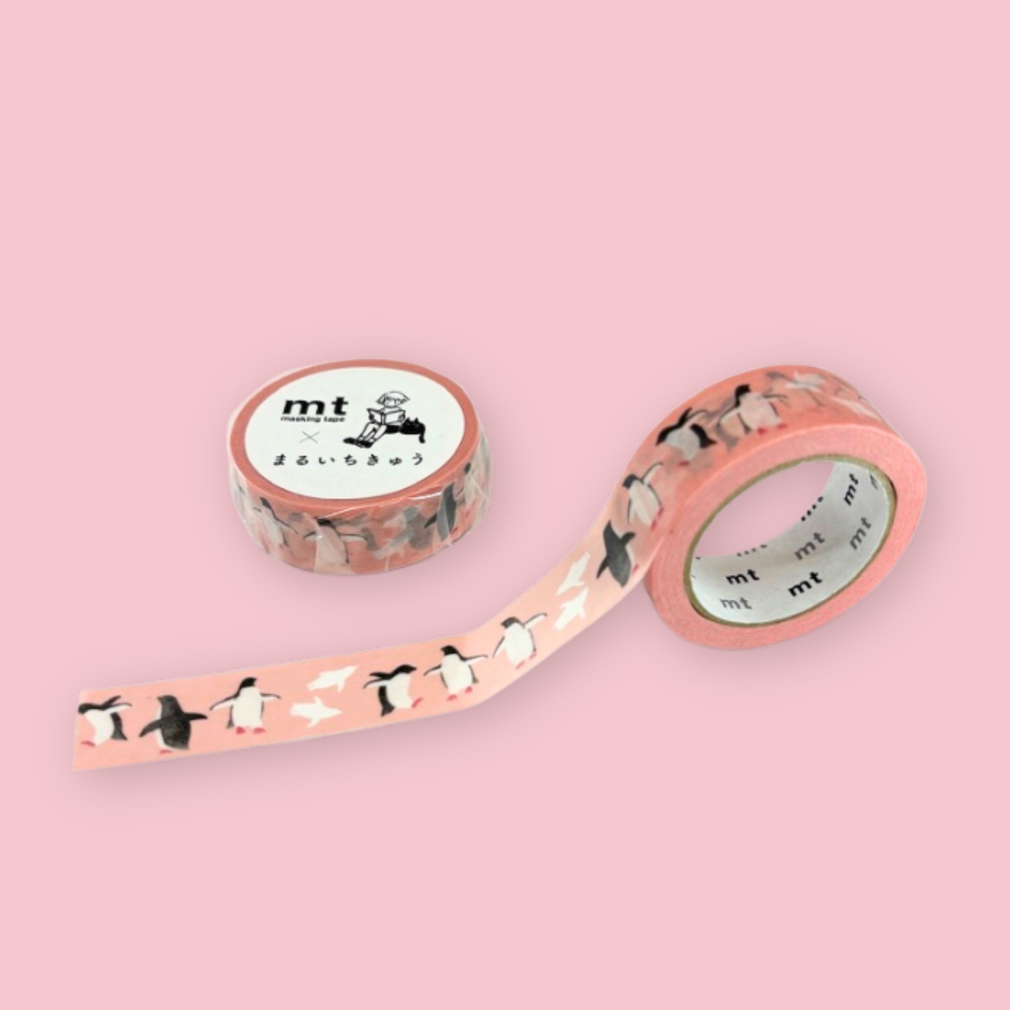 Two rolls of peach pink mt x Maruichikyu washi tape with black and white Adelie penguin illustrations on a pastel pink background.