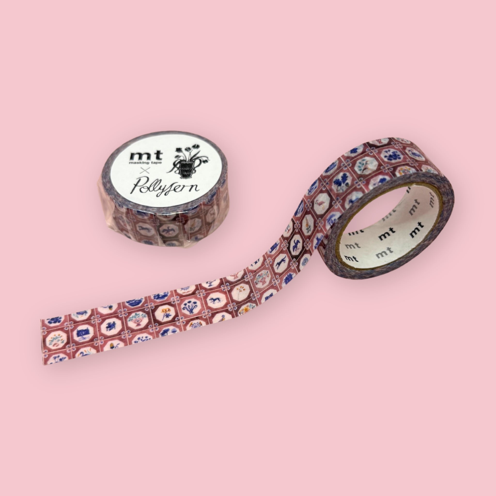mt x Polly Fern washi tape with a pink tile pattern and small illustrated animals and flowers, shown partly unspooled beside a wrapped roll on a pink background.