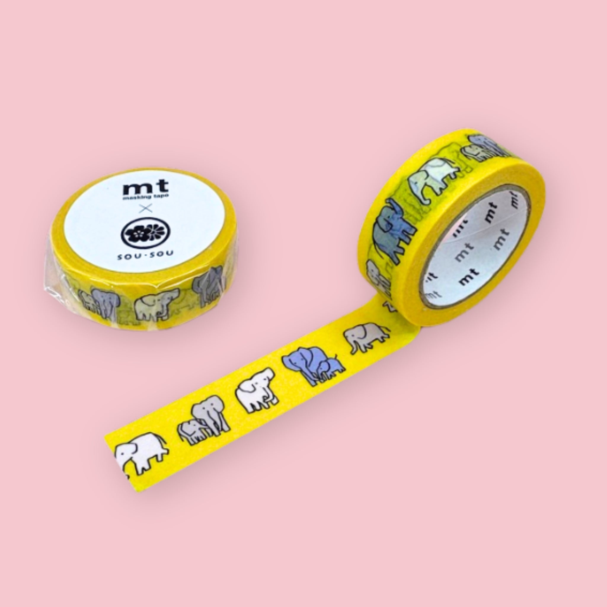 Two rolls of mt x sou sou washi tape with gray and white elephant illustrations on a bright yellow background, photographed on pastel pink.
