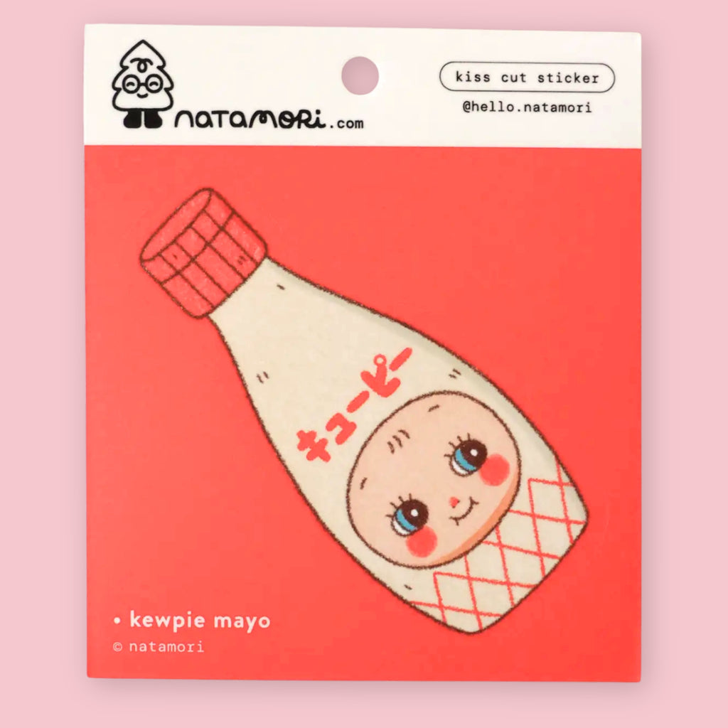 Natamori Kewpie Mayo vinyl sticker on its red backing card, shown with a craft knife lifting the corner of the Kewpie bottle sticker, with the Natamori logo and "kiss cut sticker" label visible at top