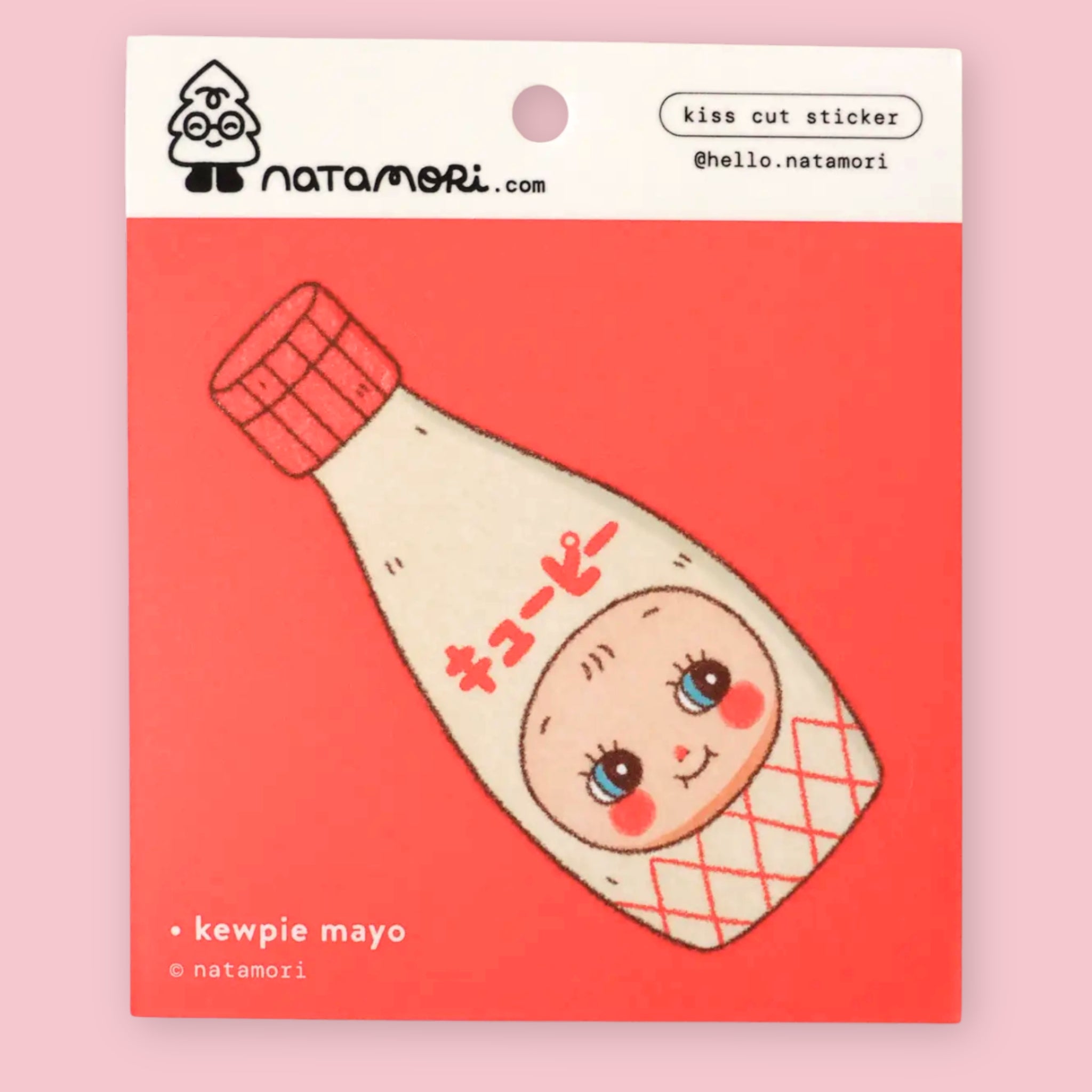 Natamori Kewpie Mayo vinyl sticker on its red backing card, shown with a craft knife lifting the corner of the Kewpie bottle sticker, with the Natamori logo and "kiss cut sticker" label visible at top