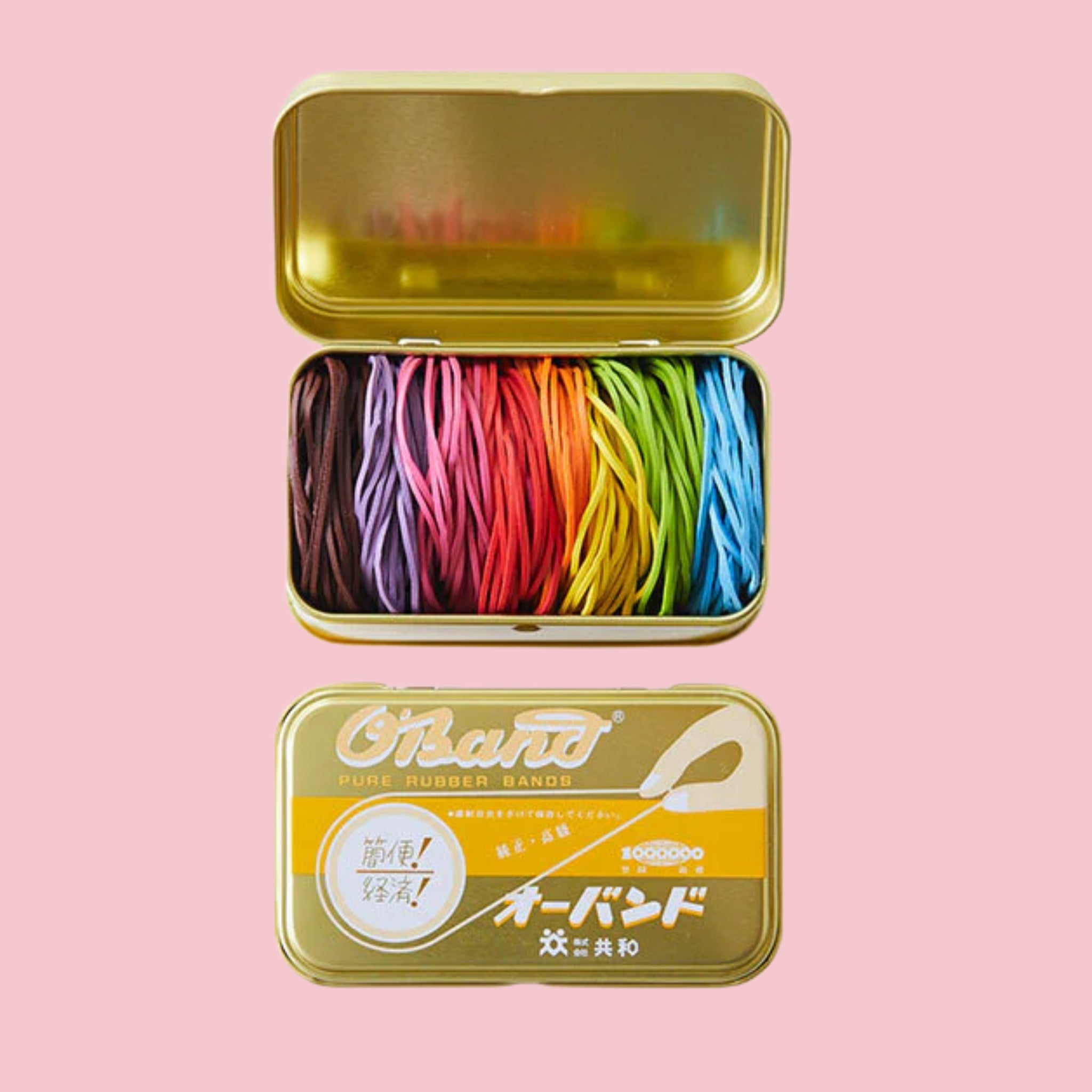 O-Band Japanese rubber band assortment in a gold storage tin with colorful rubber bands arranged by color