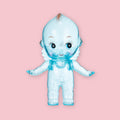 Blue translucent Obitsu Kewpie doll with blue eyes, shown standing on a pink background.