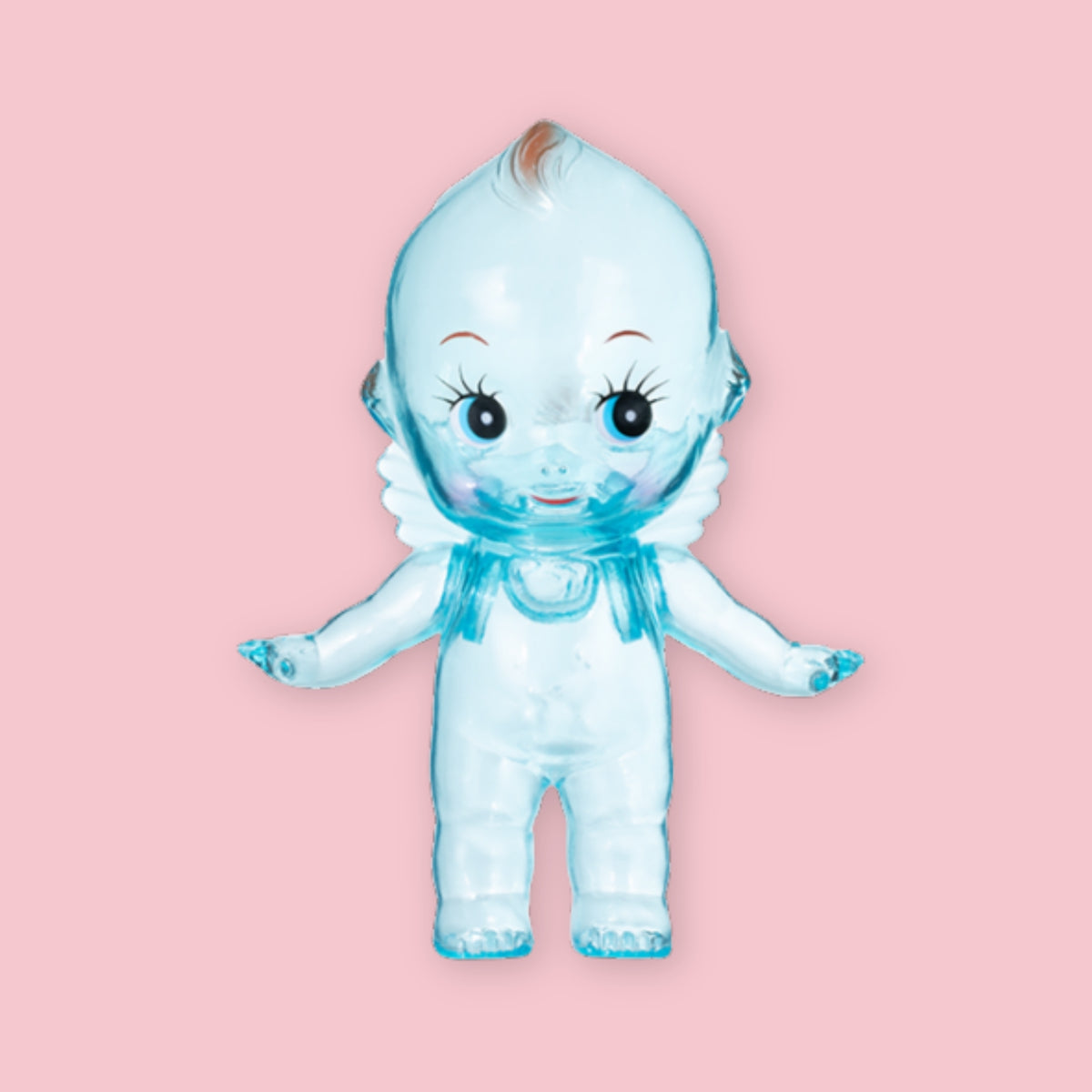 Blue translucent Obitsu Kewpie doll with blue eyes, shown standing on a pink background.
