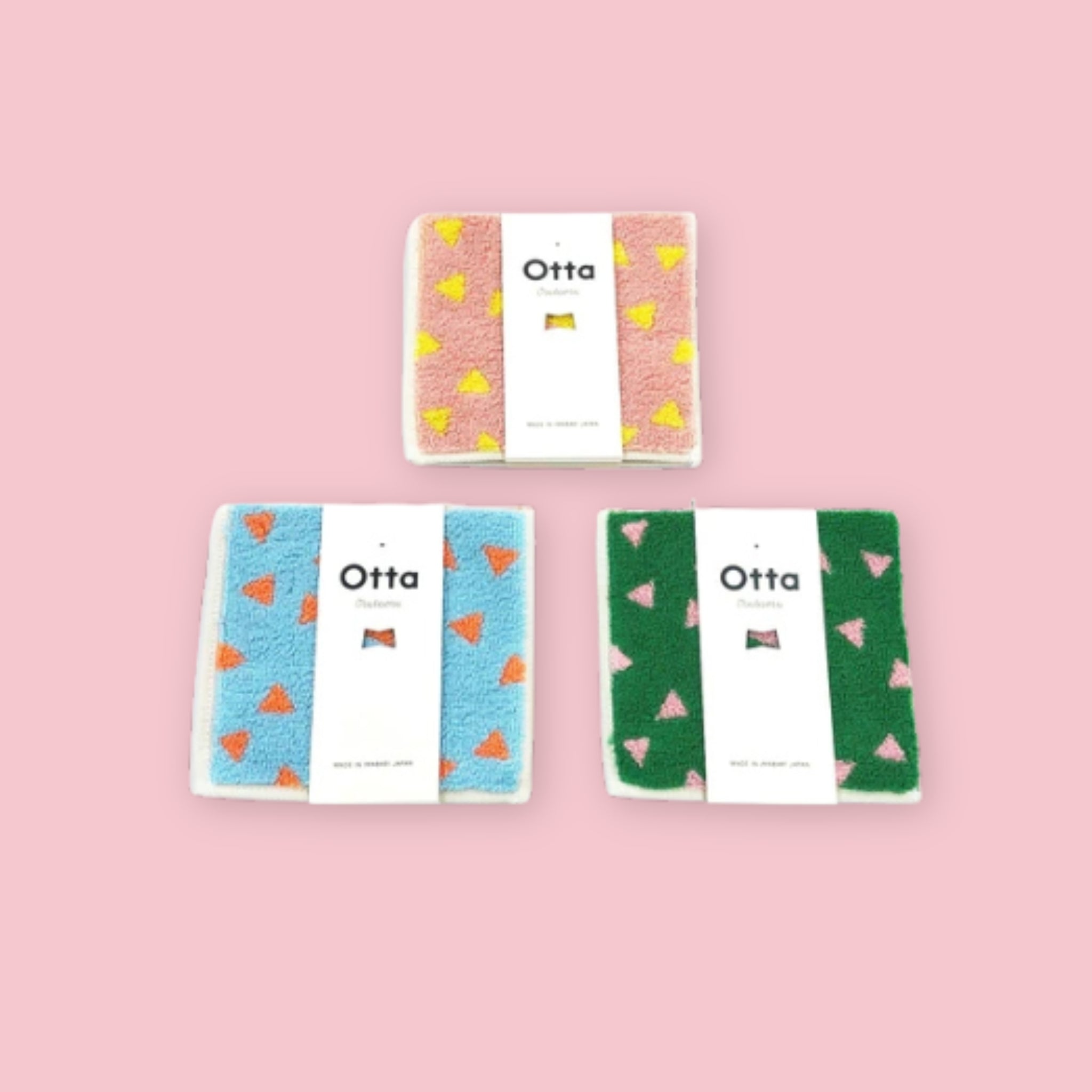 Otta Imabari Half Towel triangle pattern in three colorways, shown folded in Otta packaging, Made in Japan