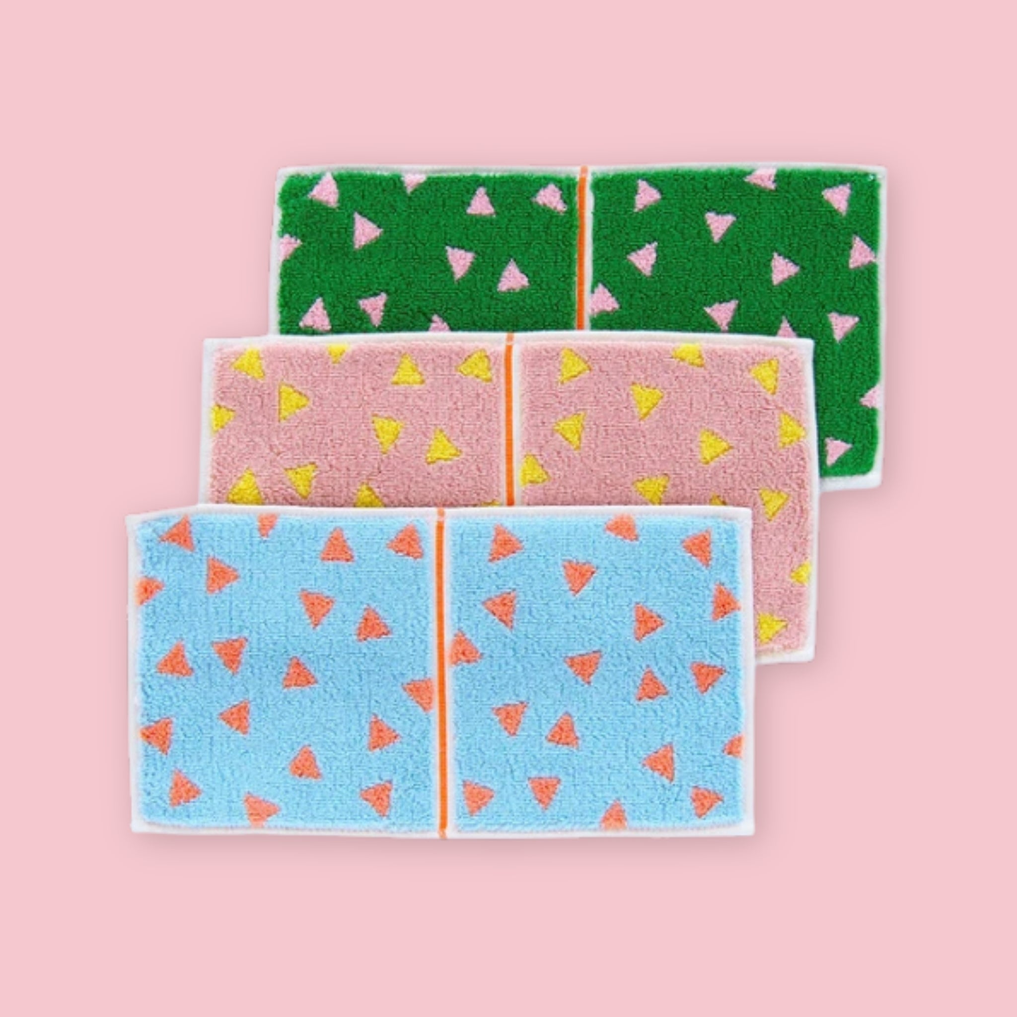 Otta Imabari Half Towel triangle pattern in green/pink, pink/yellow and blue/orange colorways, shown unfolded, Made in Japan