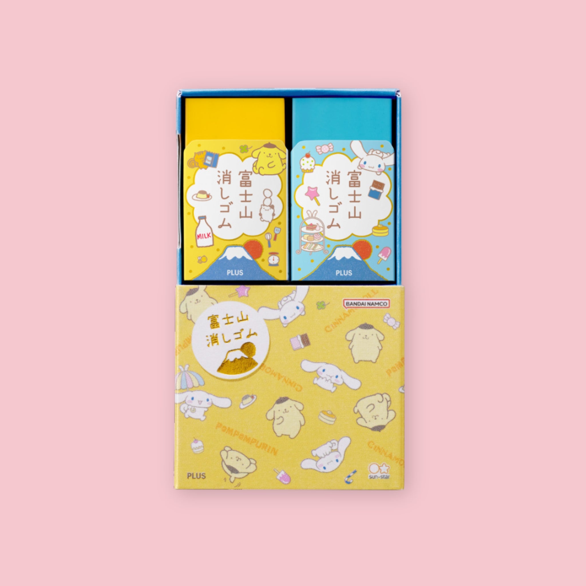 Plus Air-In Mt. Fuji Eraser two-pack in Pompompuri and Cinnamoroll limited edition Sanrio foil-stamped packaging, showing individual eraser boxes in yellow and blue with character illustrations and outer display box on a pink background