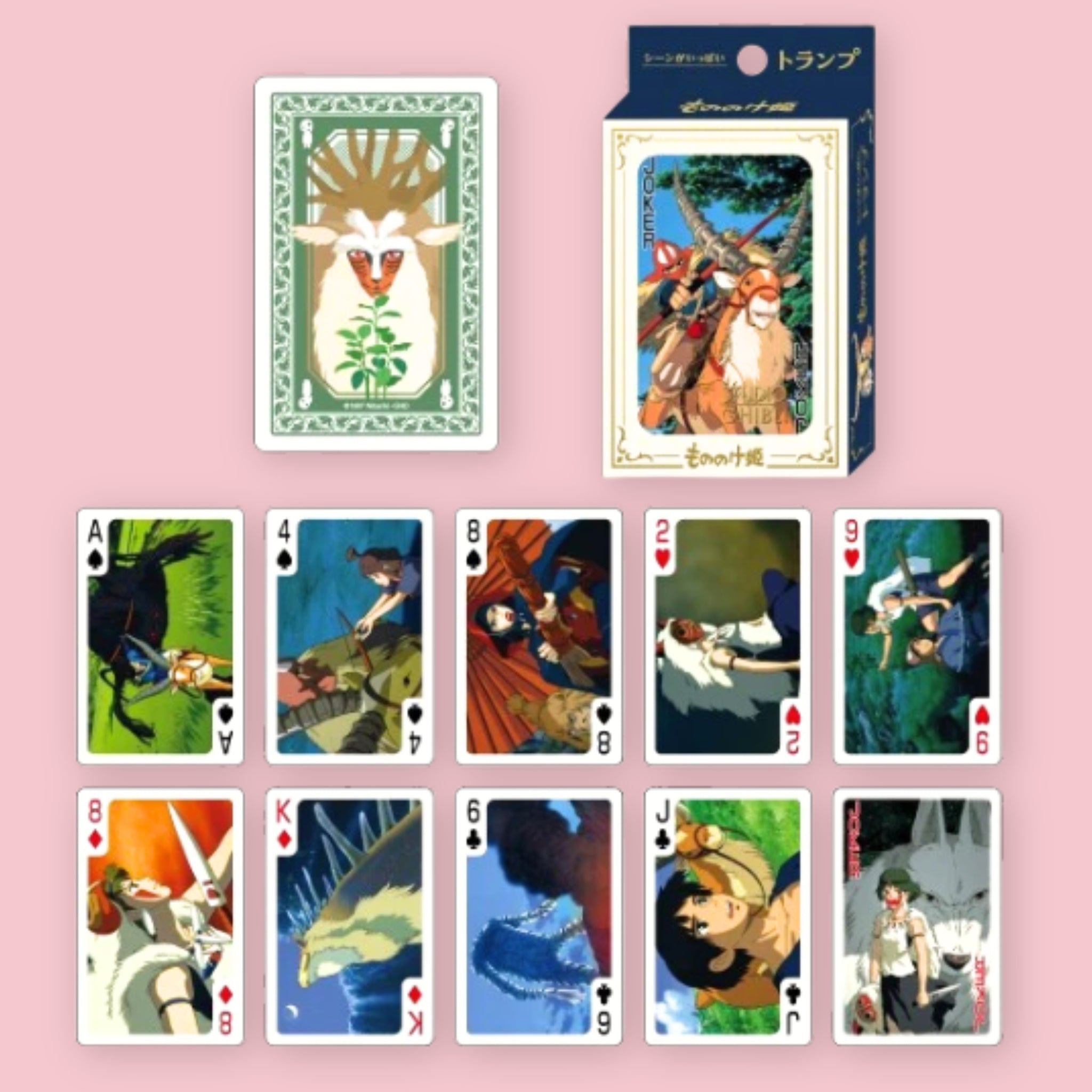 Studio Ghibli Princess Mononoke playing cards with card box and a card back design featuring a forest spirit, shown alongside an assortment of face cards illustrated with scenes and characters from the film, against a pink background