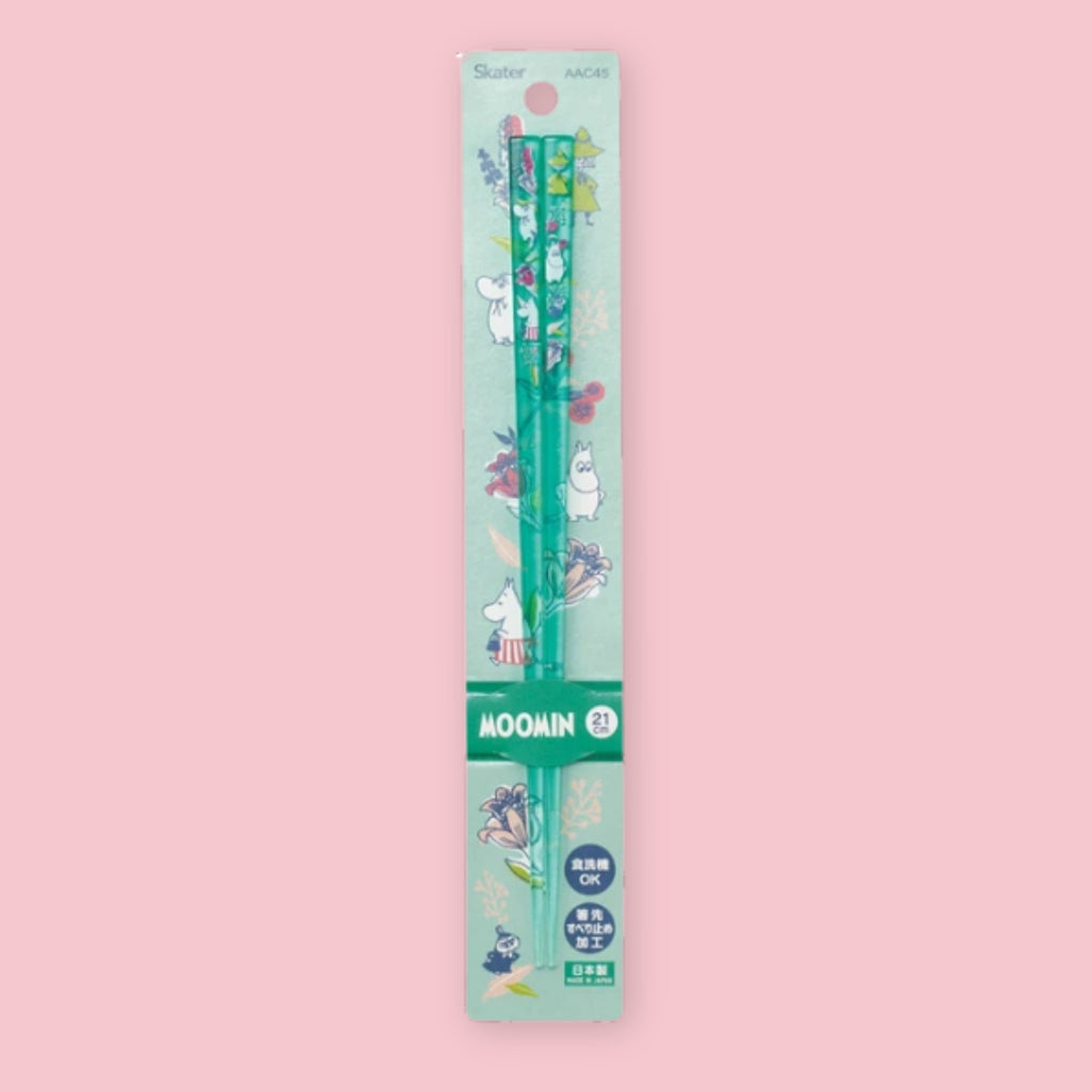 Transparent teal Moomin chopsticks decorated with small character illustrations in packaging on a pink background