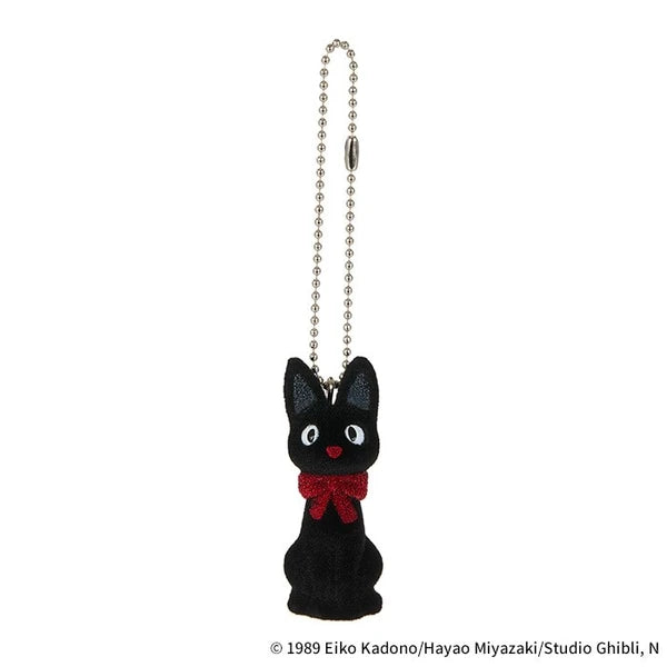 Studio Ghibli Jiji flocked charm keychain with red bow and ball chain, shown on a white background.