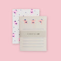 Mizushima Sumo letter writing set showing white and coarse paper sheets with neon sumo wrestler illustrations on a pink background