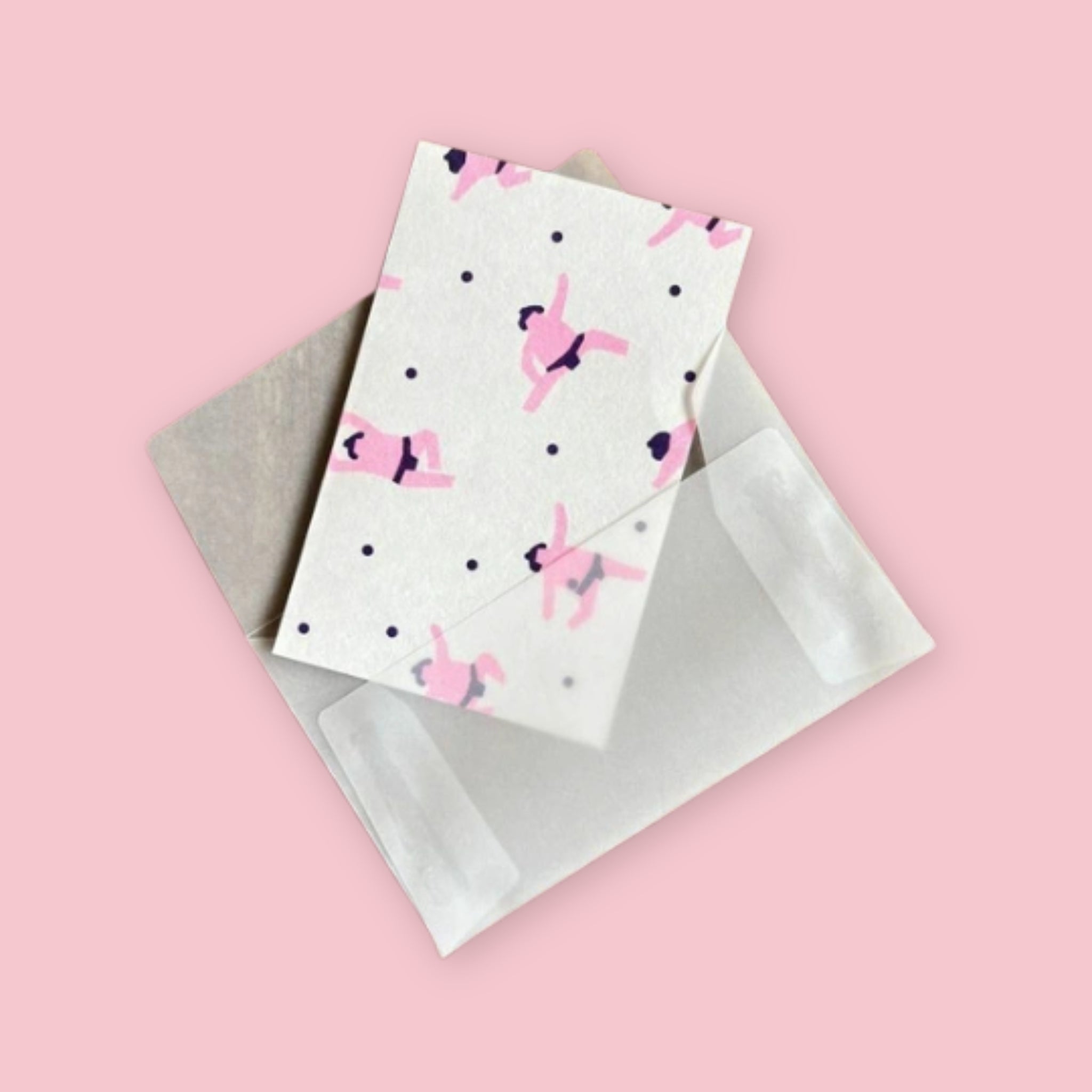Mizushima Sumo letter writing set showing a sumo-printed sheet tucked into a transparent envelope on a pink background