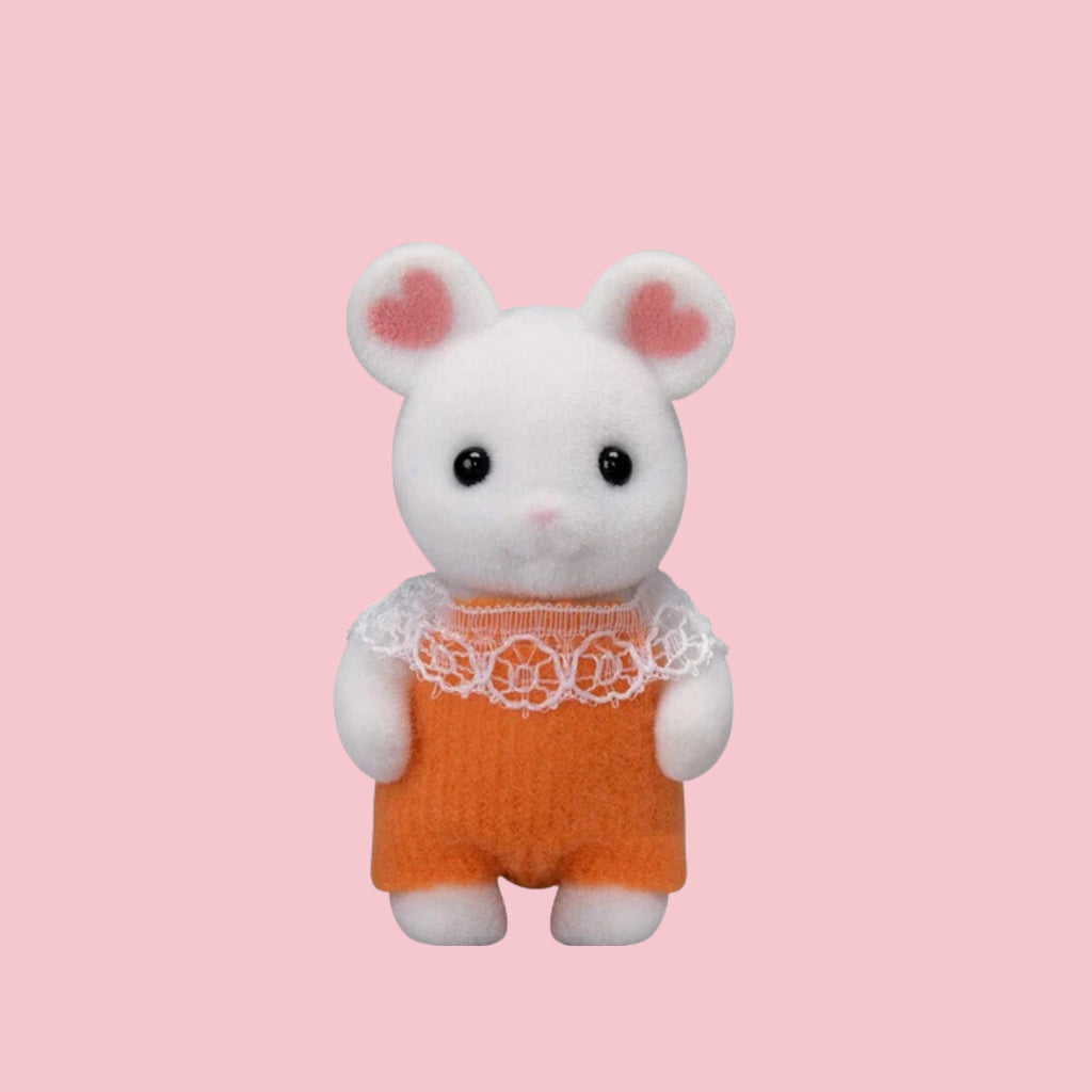 Sylvanian Families mouse baby figure in green outfit, shown against a pink background.