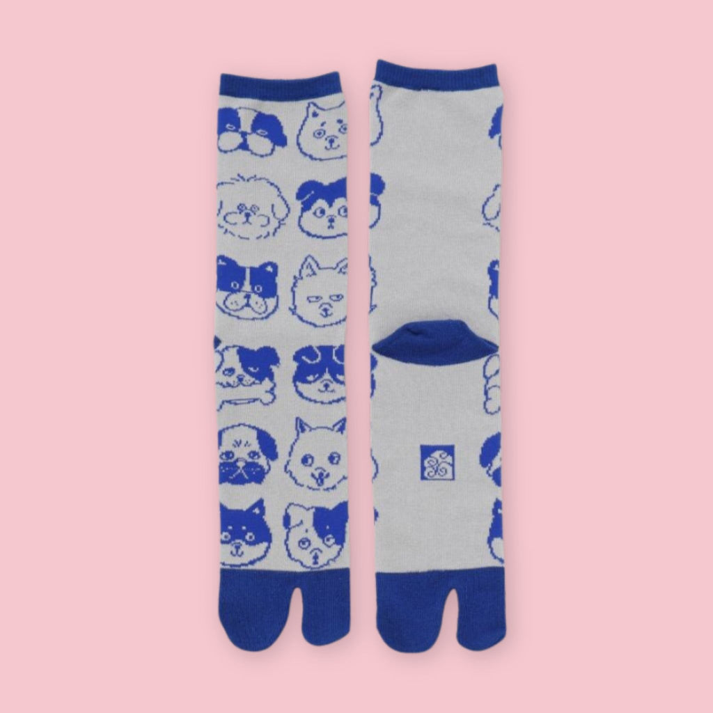 Blue and gray Japanese tabi socks with assorted dog faces and traditional split-toe design, shown front and back.