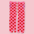 Pink Japanese tabi socks with red polka dots and traditional split-toe design.