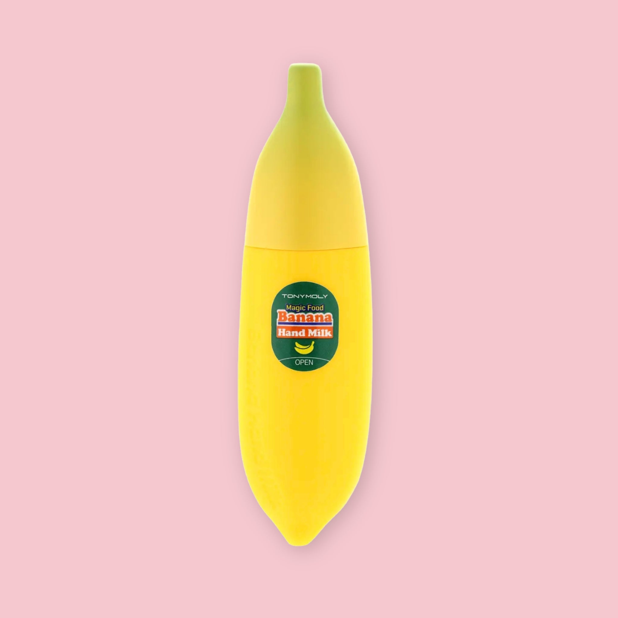 TonyMoly Banana Hand Milk in a yellow banana-shaped bottle with a green cap and green label, on a pink background.