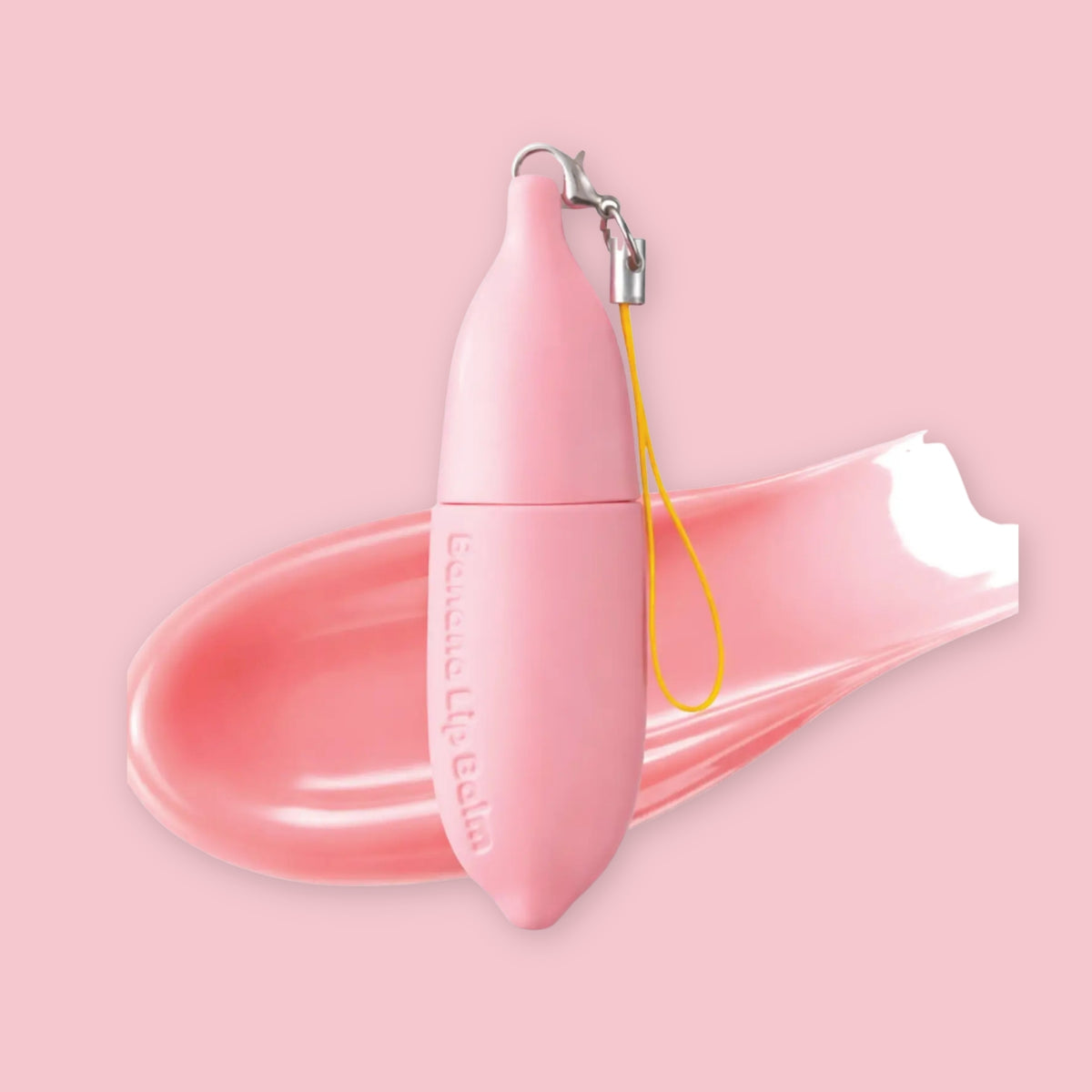 TONYMOLY Pink Berry Banana Lip Balm in pink banana-shaped packaging with keychain strap