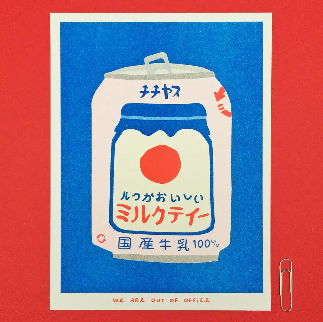 We Are Out of Office risograph art print featuring a Japanese milk tea can illustration on a blue background, photographed against red with a paper clip.
