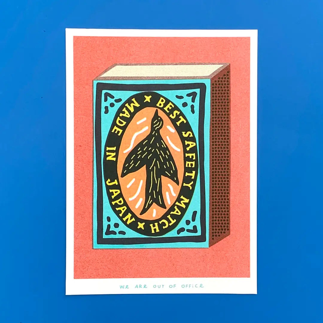 We Are Out of Office risograph art print featuring a vintage Japanese safety matchbox illustration, photographed on a blue background.