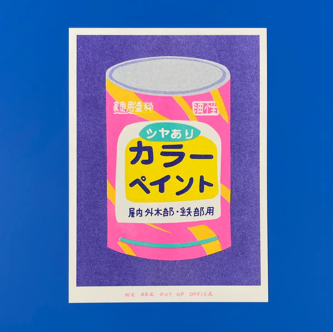 We Are Out of Office risograph art print featuring a pink Japanese color paint can illustration on a purple background, photographed against blue.