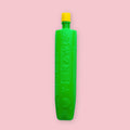 Yamato Nori paste in a tall green bottle with a yellow cap and embossed Japanese text, on a pink background.